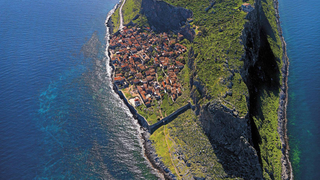 This Greek island is the perfect paradise—and supervillain hideout